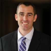 a headshot of Dr. Manor