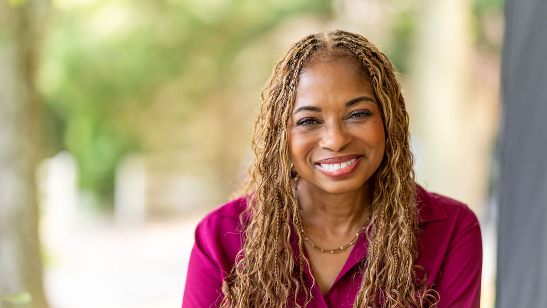 Smiling woman in red shirt