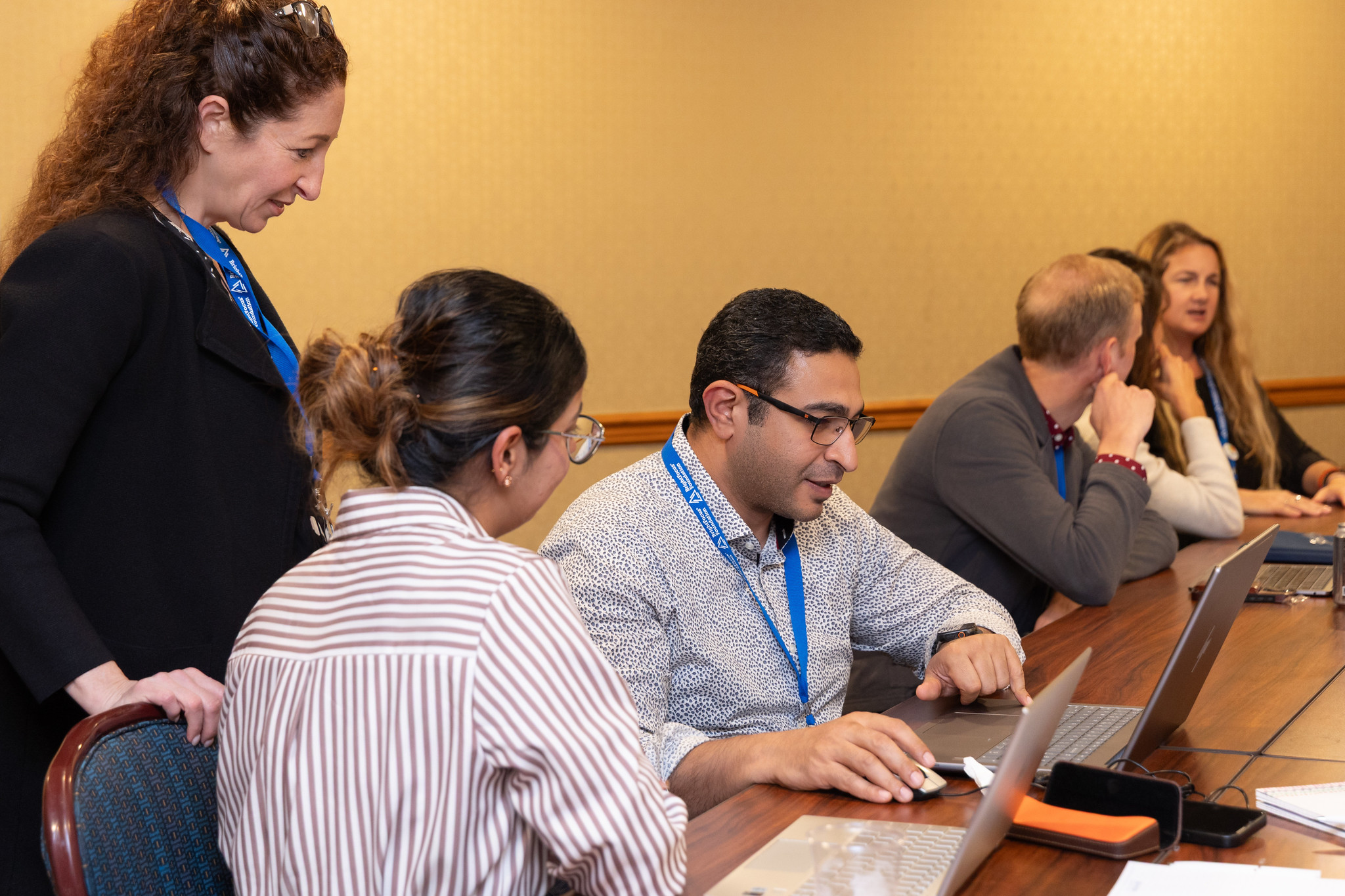 Stacey Sukoff Rizzo, PhD, far left, shares feedback with students.