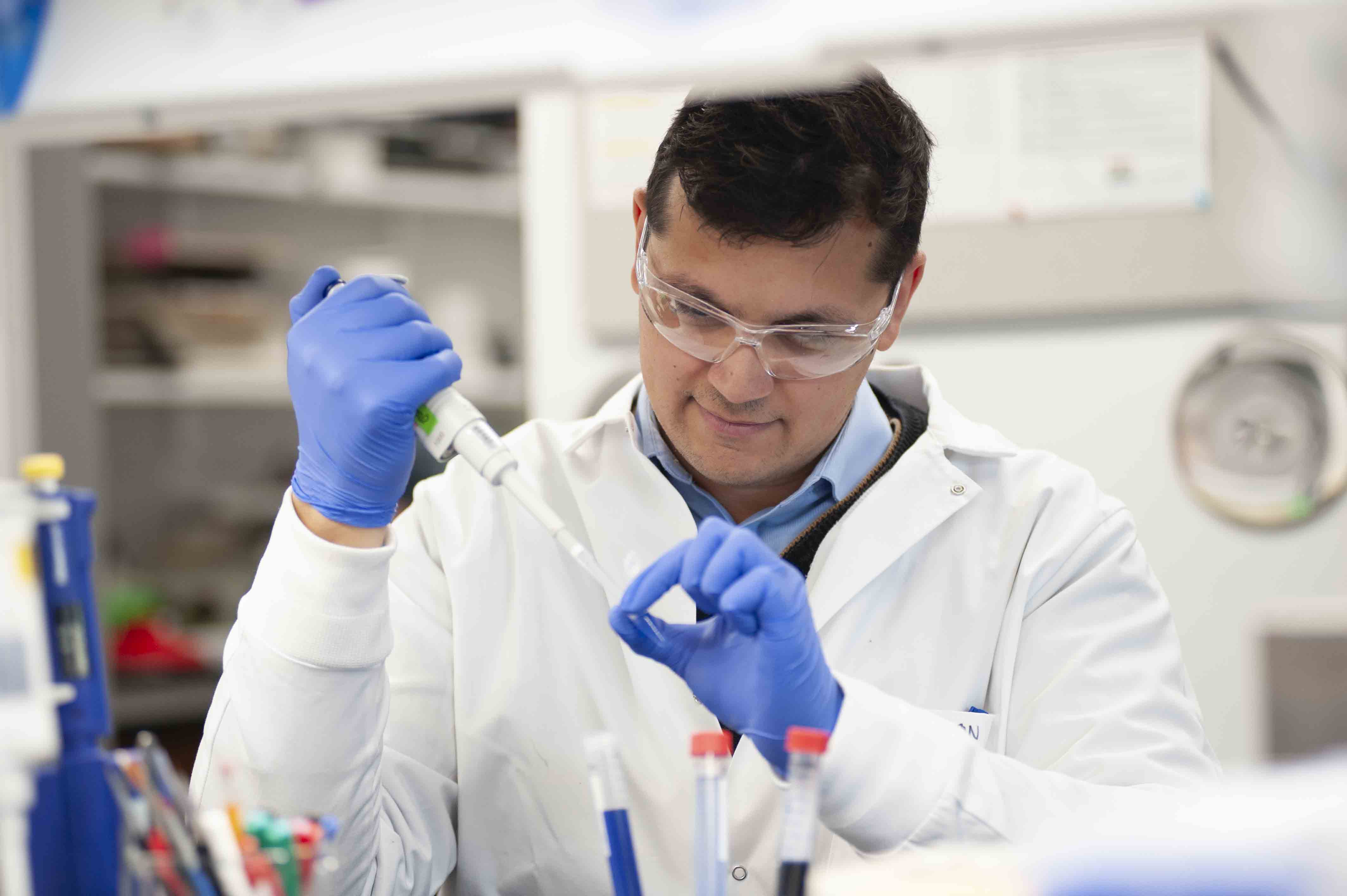 Joshua Emmerson, PhD working in a lab.