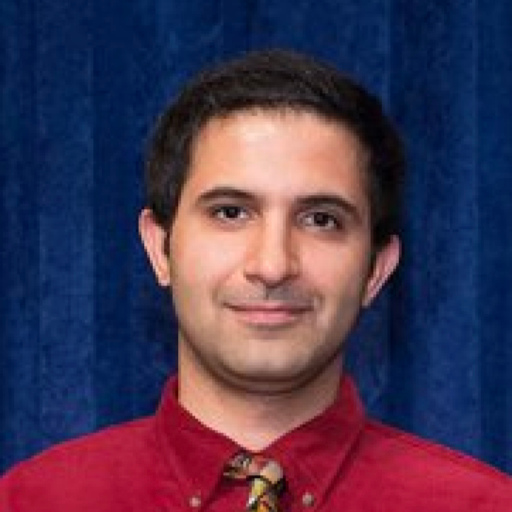a headshot of Navid Amini, PhD