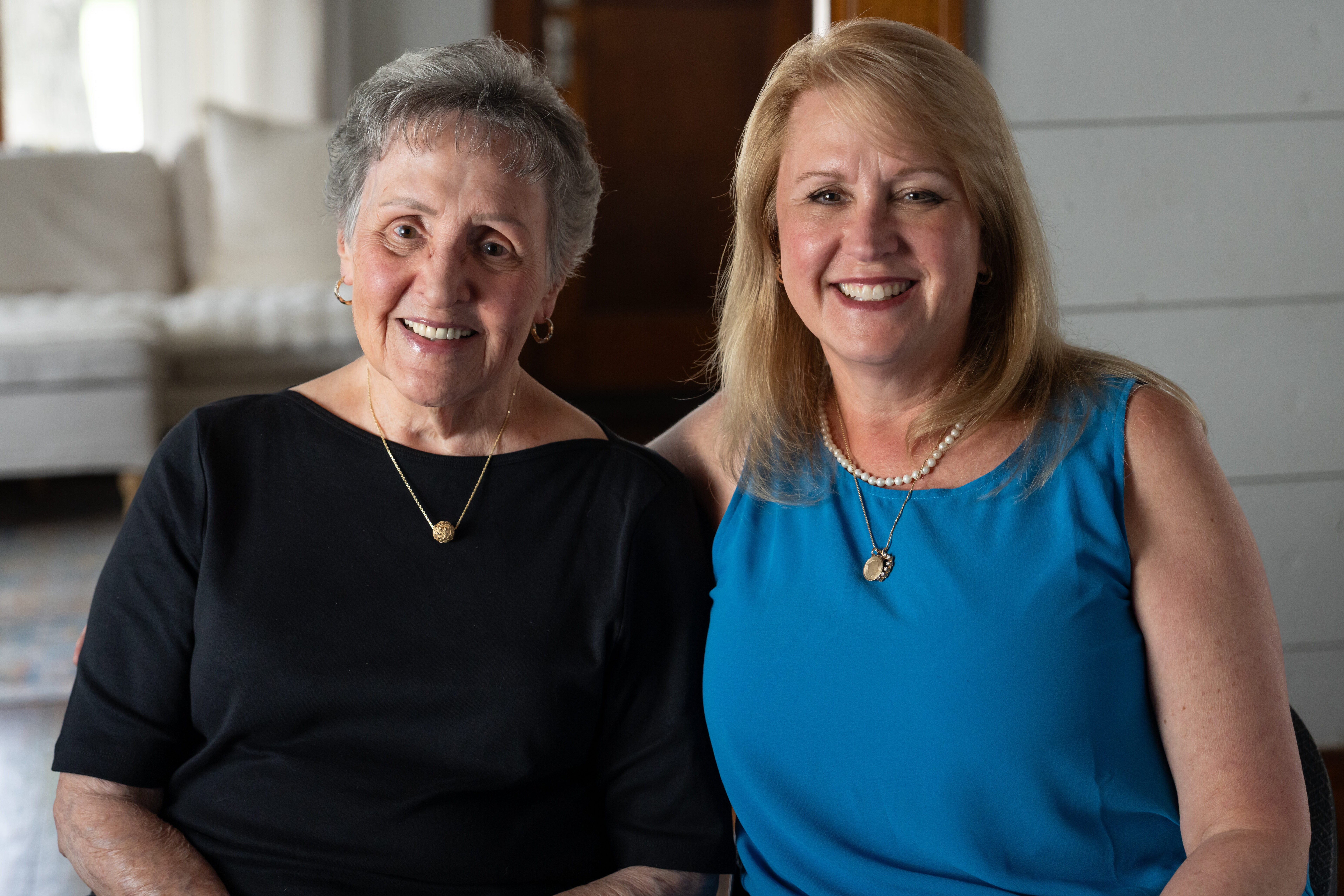 Teri and Gail Youngdale sitting down together happily.