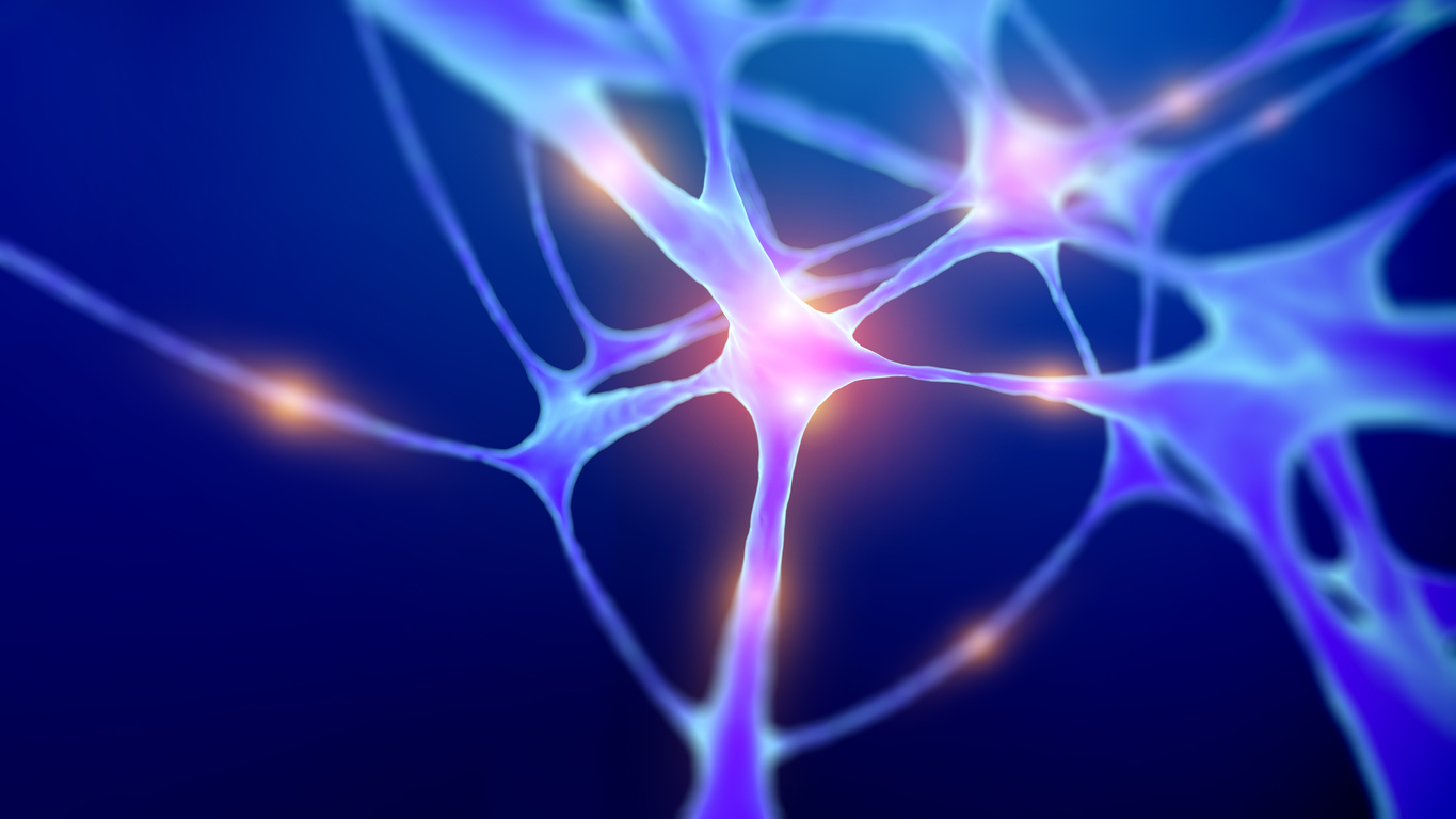 A 3D rendering of a firing neuron glowing blue with flashes of pink in the center.